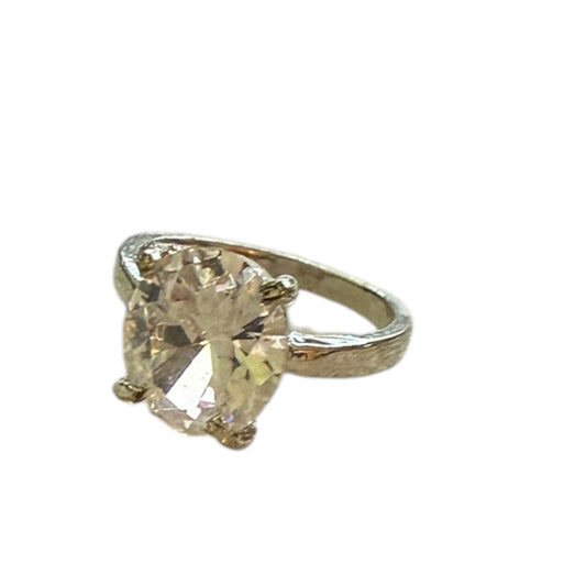 Silver ring with a large CZ on a white background