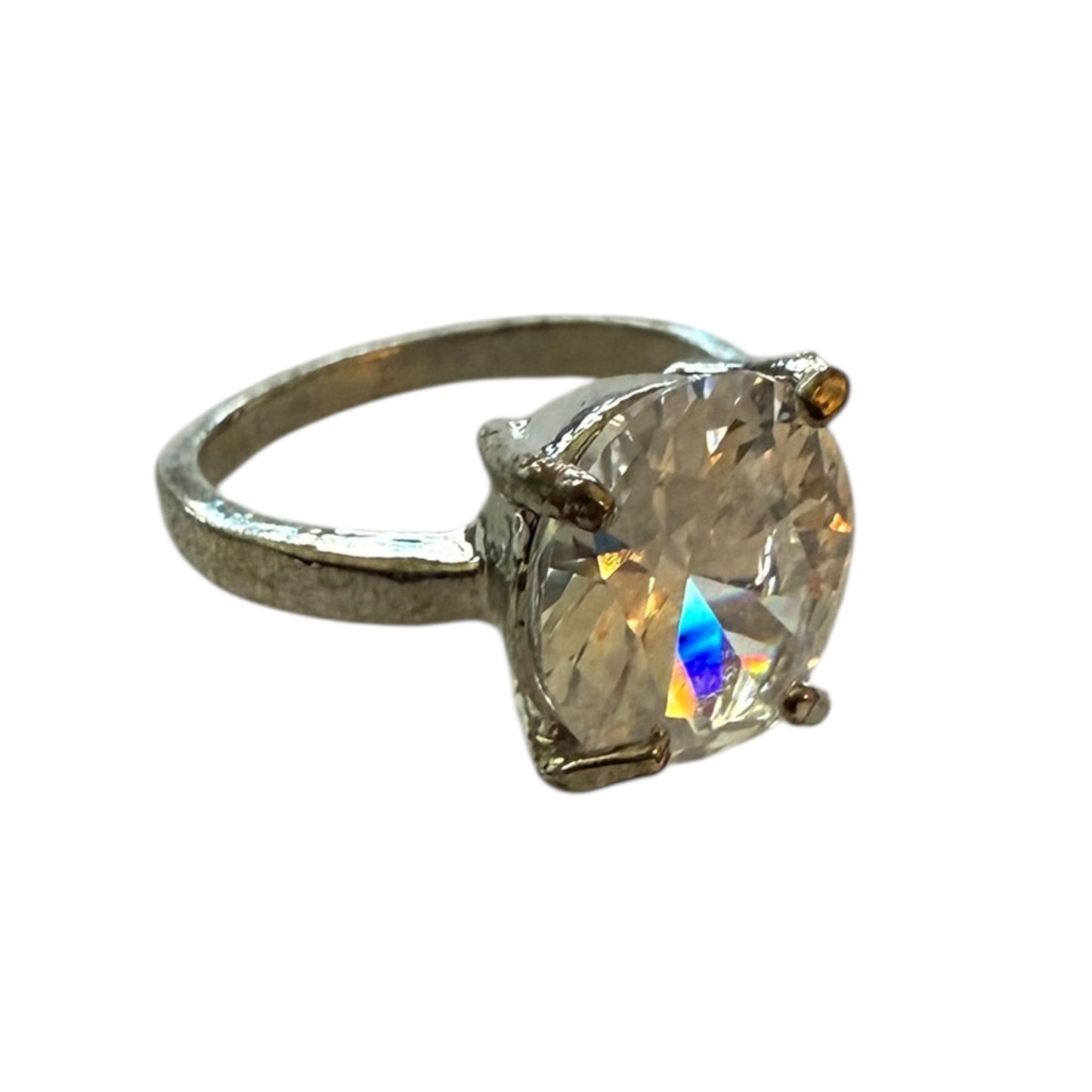 Silver ring with a large CZ gemstone on a white background