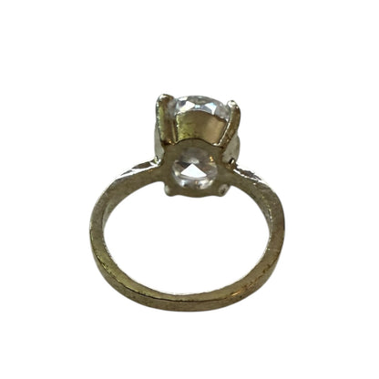 Silver ring with large CZ stone on a white background