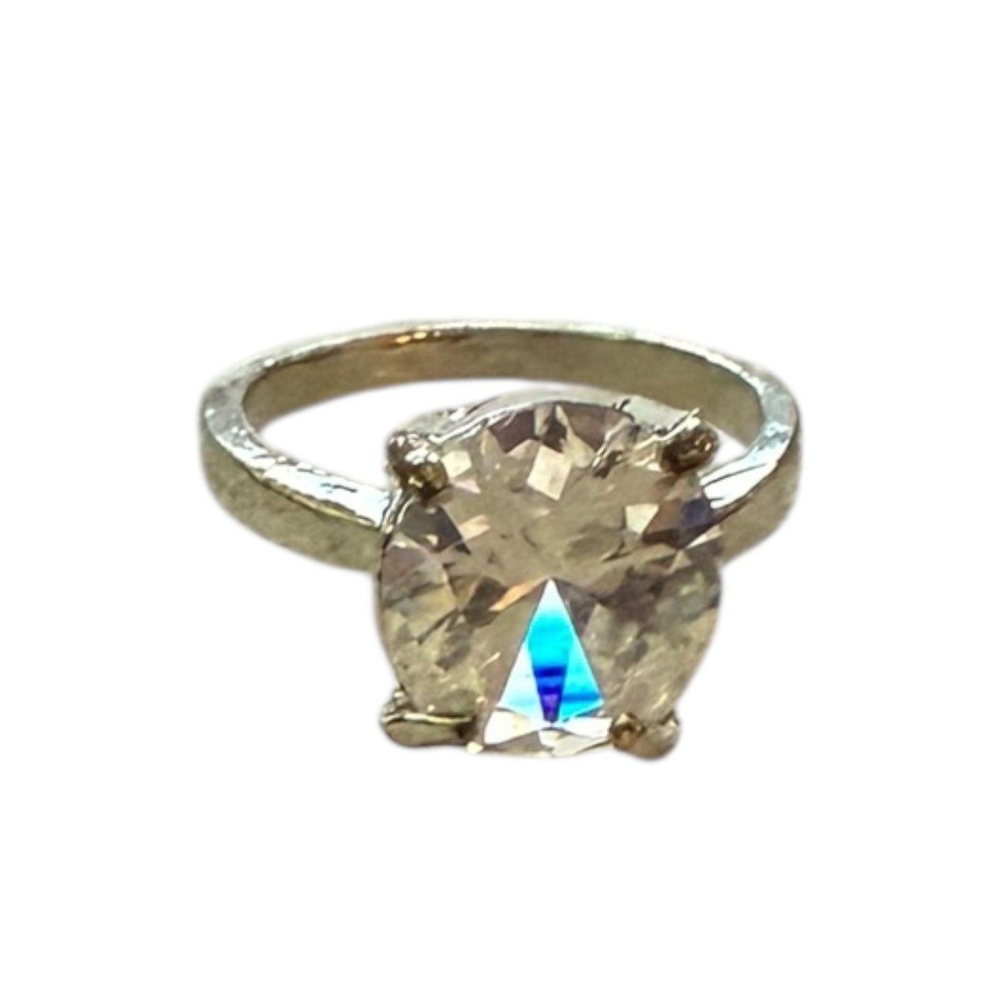 Silver ring with a large CZ diamond on a white background