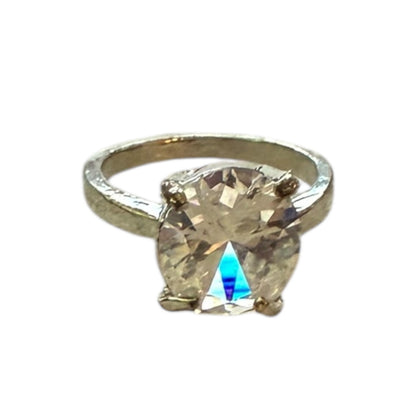 Silver ring with a large CZ diamond on a white background