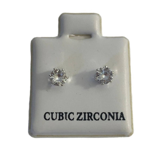 A pair of round-cut cubic zirconia stud earrings displayed on a white ceramic jewelry card labeled 'CUBIC ZIRCONIA'.