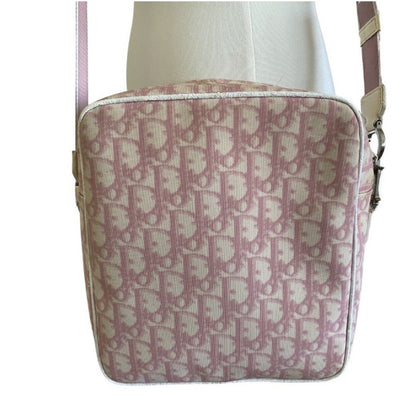 Pink Patterned handbag on a mannequin with a white background