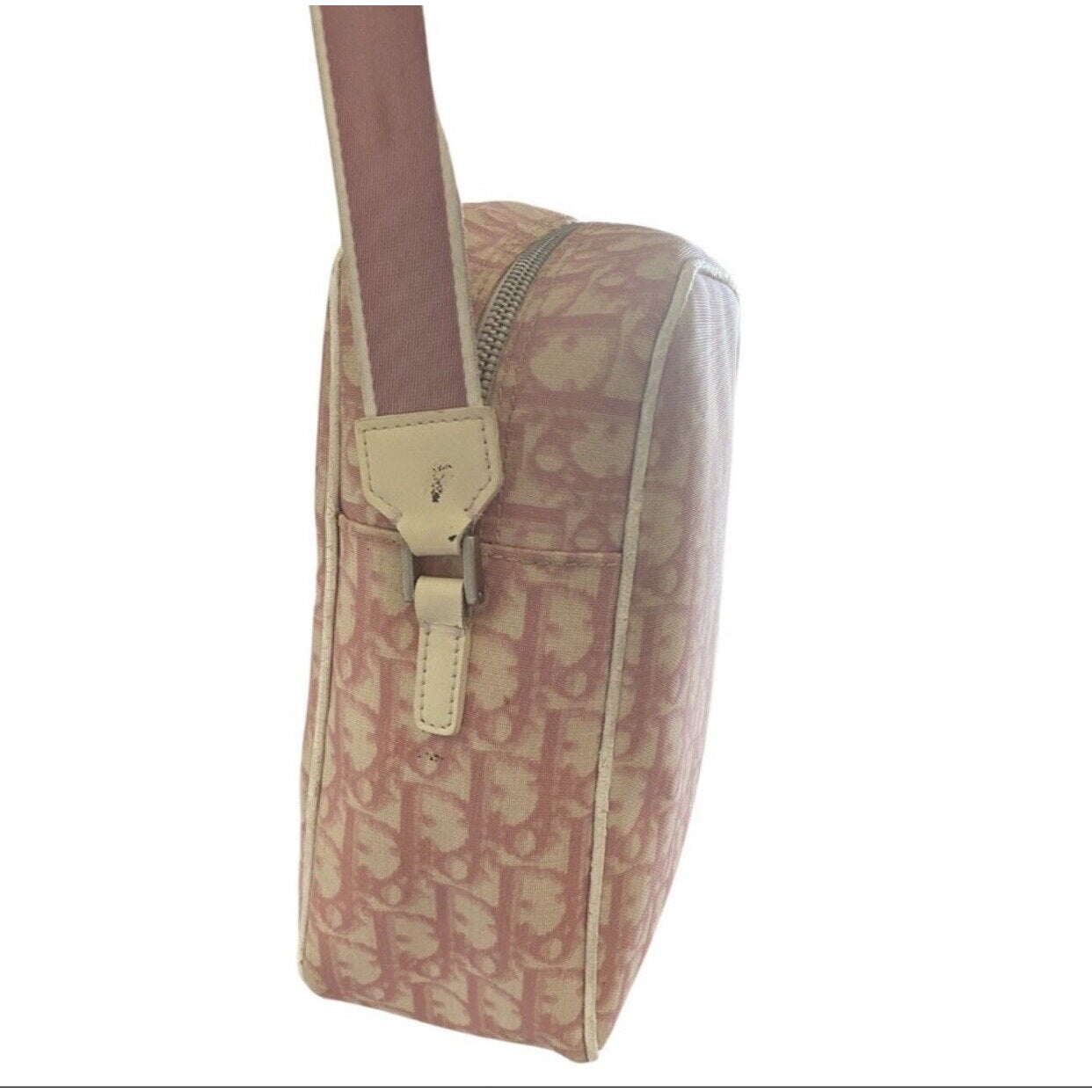 Side of bag with a pink patterned design on a white background