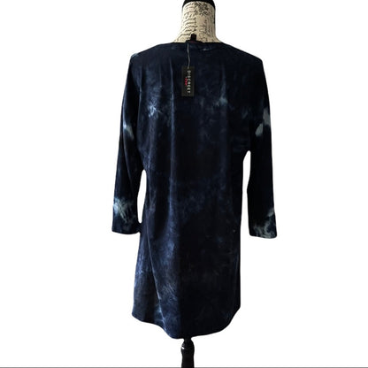 A long-sleeve dress in dark navy blue with a cloudy, mottled tie-dye pattern, displayed on a dress form mannequin against a white background.