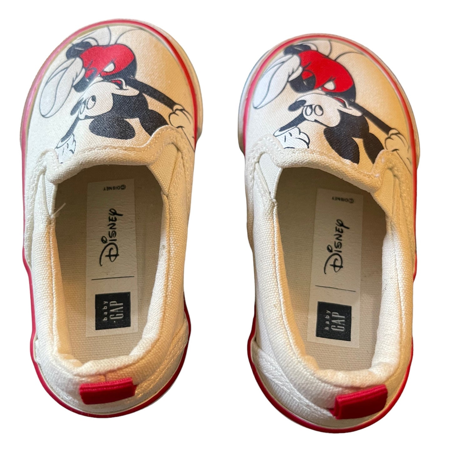 Top of a Pair of children's shoes with cartoon character design on a white background