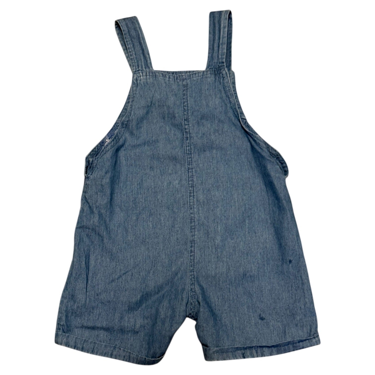 Back of Blue denim overalls on a white background