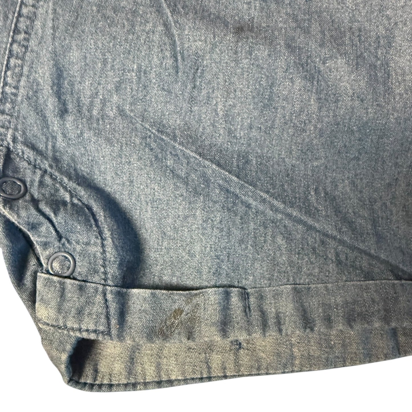 Close-up of a blue denim fabric with mark