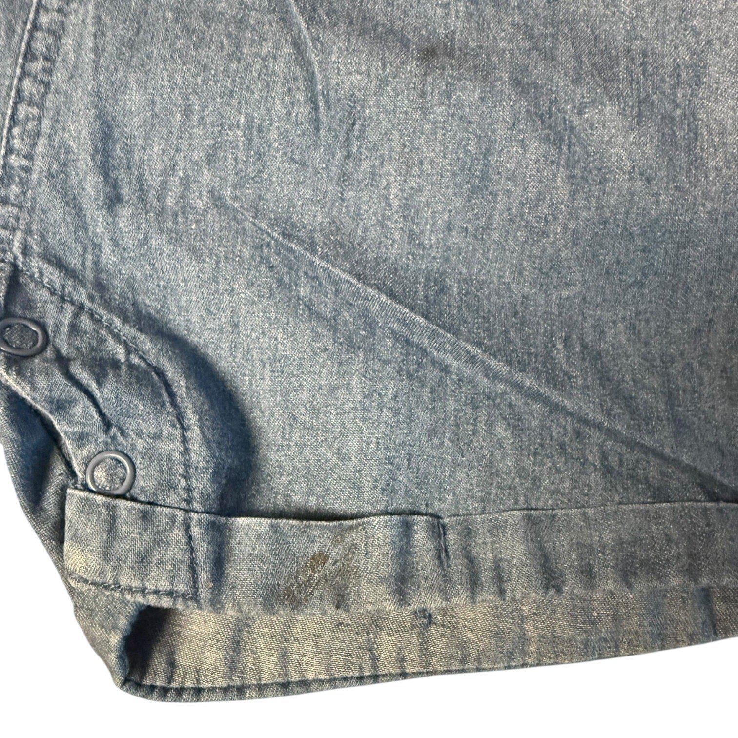 Close-up of a blue denim fabric with mark