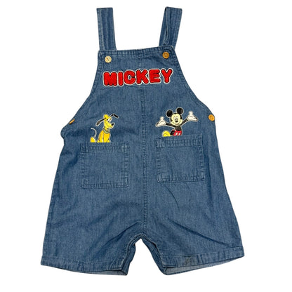 Front of Blue denim overalls with Mickey Mouse and Pluto design on a white background