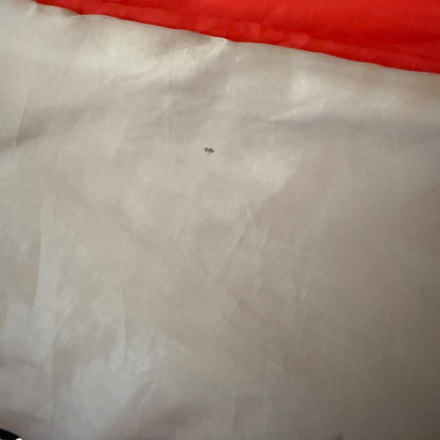 Close-up of a mark on fabric of sleeping bag .