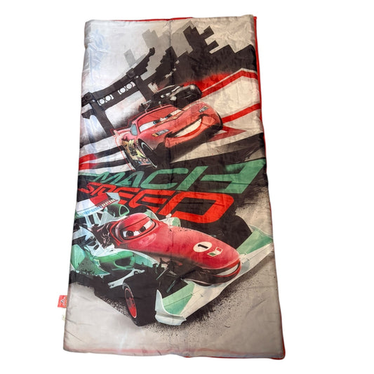 Children's sleeping bag with race car design on a white background