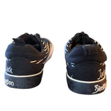 Black sneakers with white text on a white background