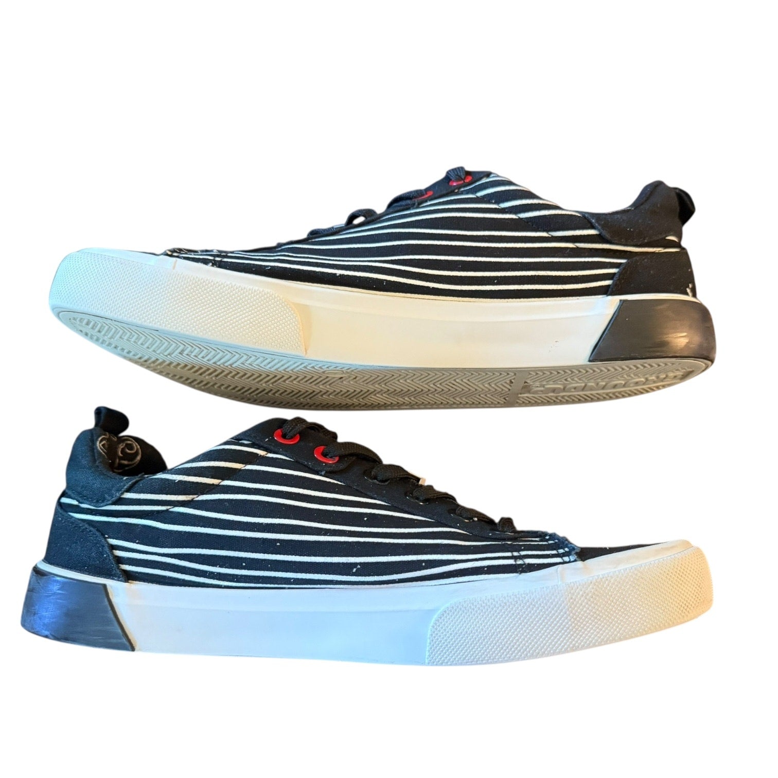 Pair of striped sneakers on a white background