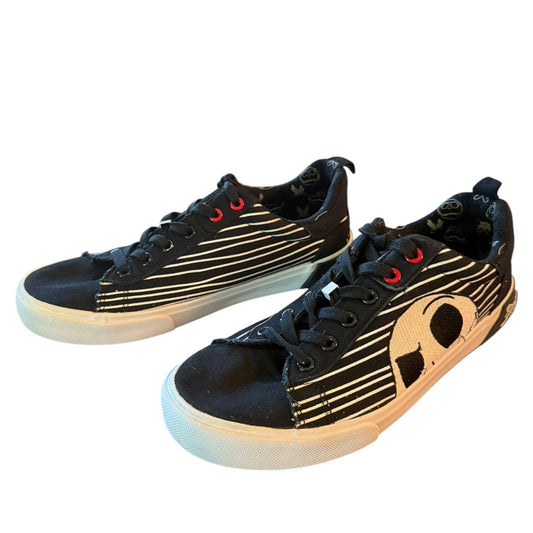 Black sneakers with white skeleton patterns on a white background