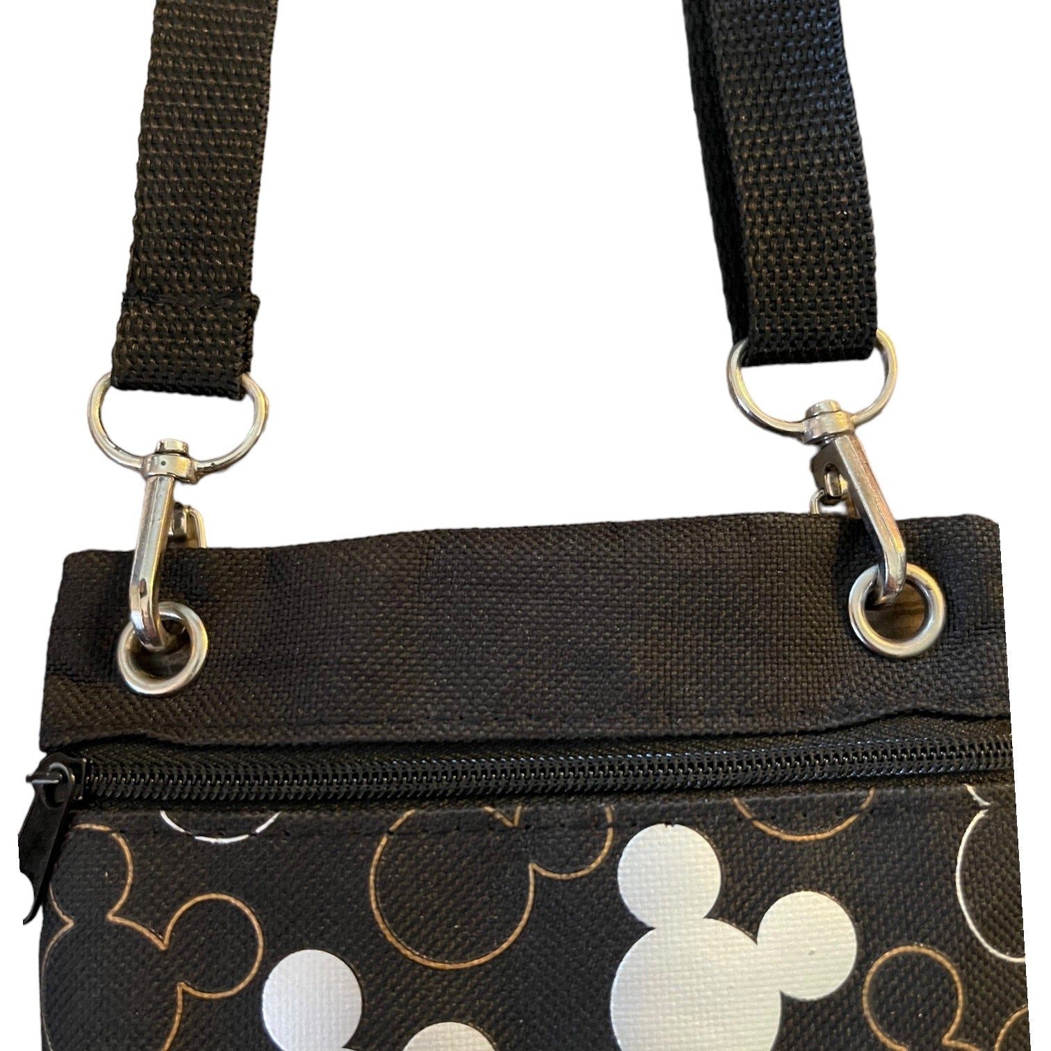 Close up of handbag straps on a white background