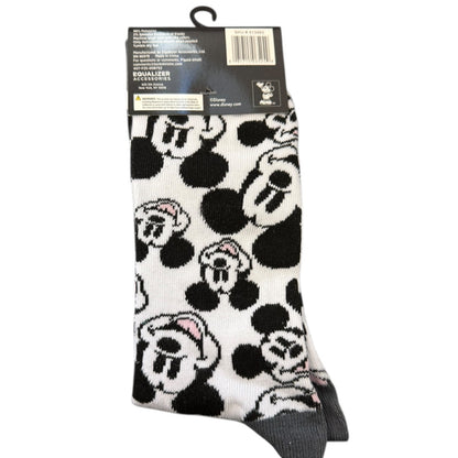 Black and white patterned sock with cartoon character design on a white background