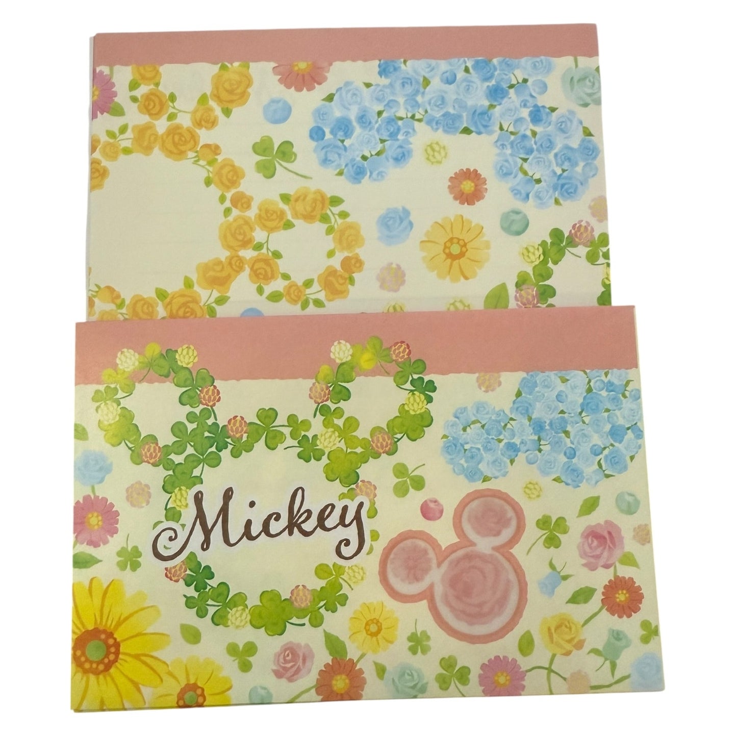 Floral patterned stationery with 'Mickey' text and logo on a white background