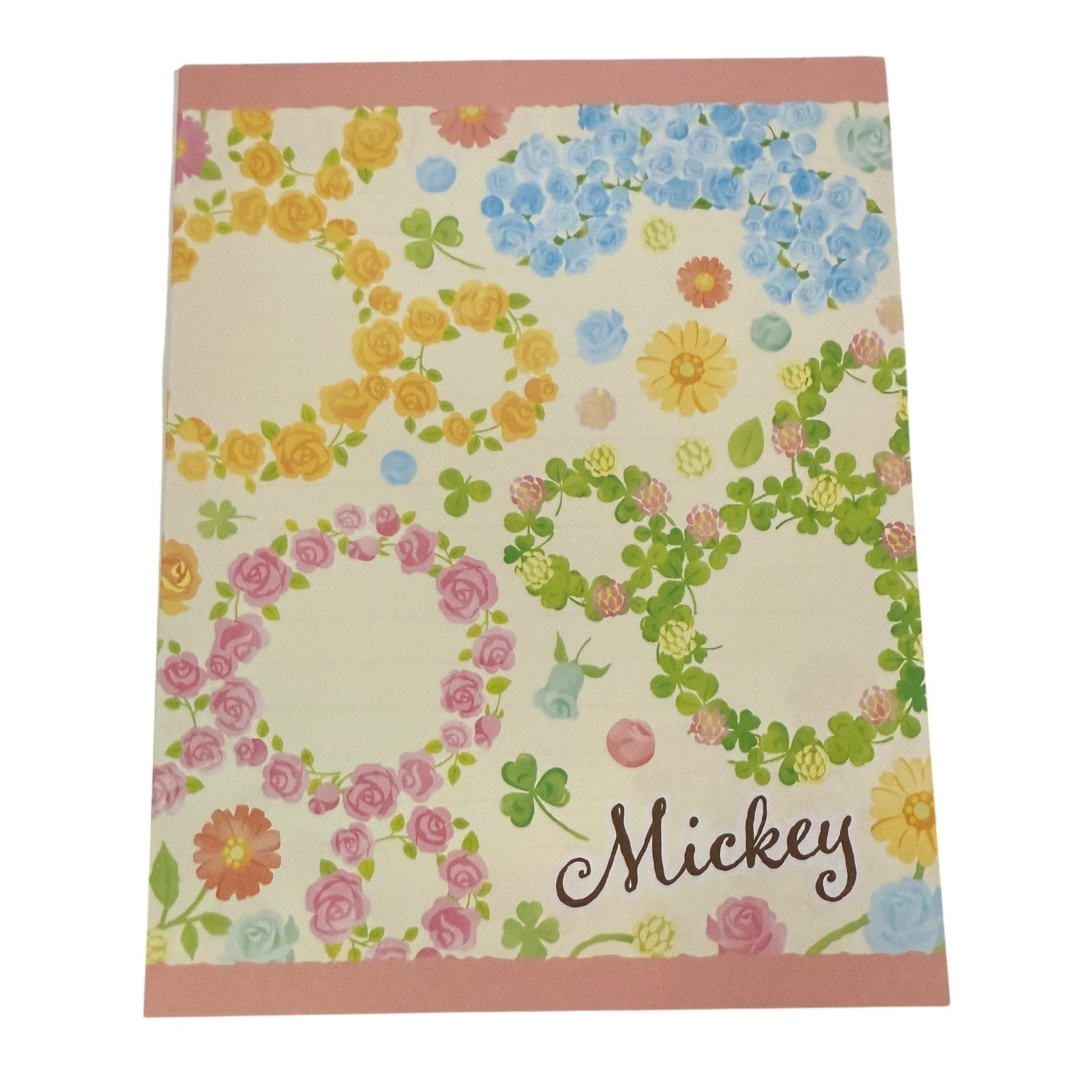 Floral patterned staionary with 'Mickey' text on a white background