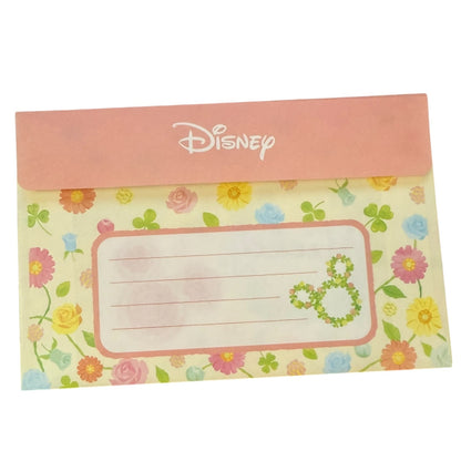 Floral design with Disney logo on a pink envelope on a white background