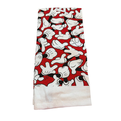 Towel with cartoon hand prints on a red background