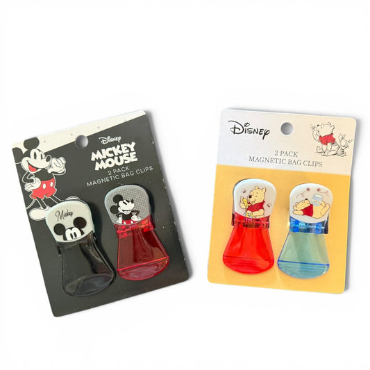 Two packages of Disney-themed magnetic bag clips featuring Mickey Mouse and Winnie the Pooh.