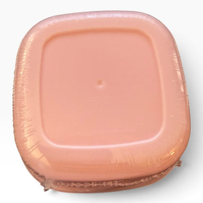 Bottom of pink container on a white background