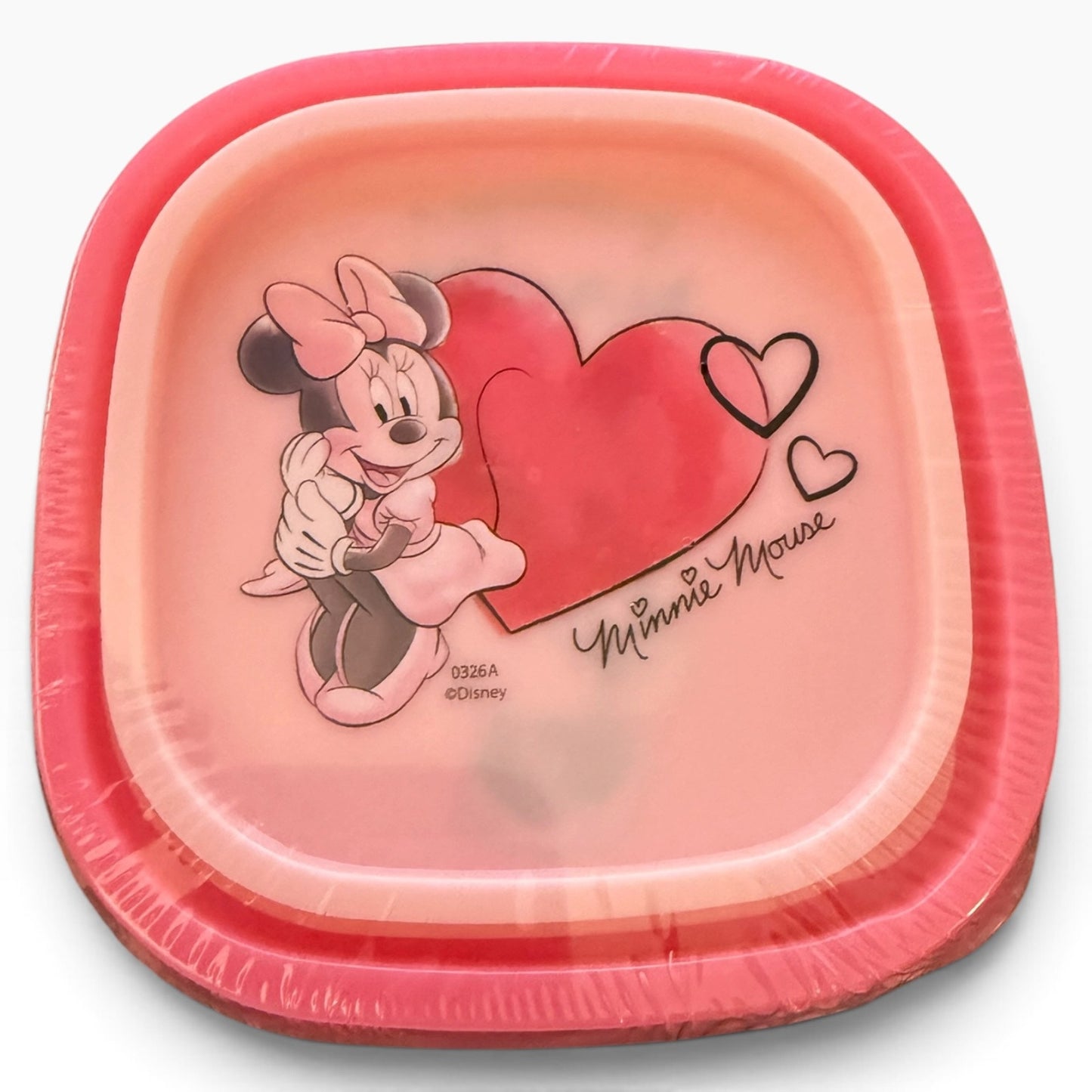 A storage food containers with corners, featuring a pink and red Valentine's theme. The top plate is printed with an illustration of Minnie Mouse hugging a large red heart, accompanied by the 'Minnie Mouse' signature and 'Disney' copyright text.