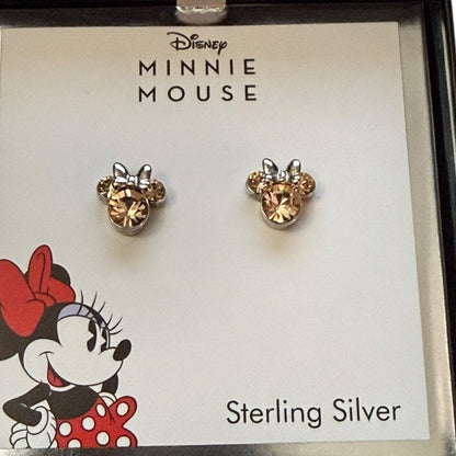Minnie Mouse earrings on a branded card with Disney logo
