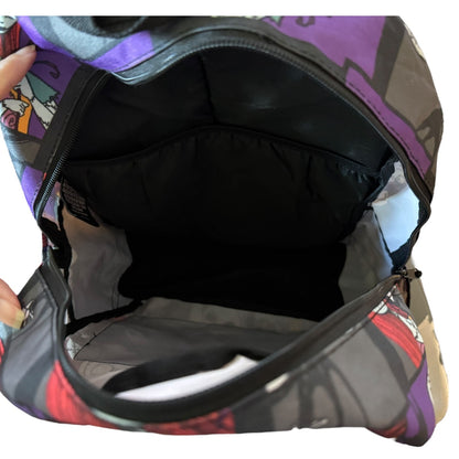 Multicolored backpack with open front compartment on a white background