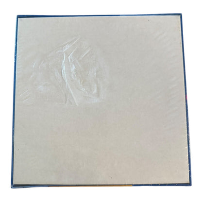 Back of puzzle with rip in package