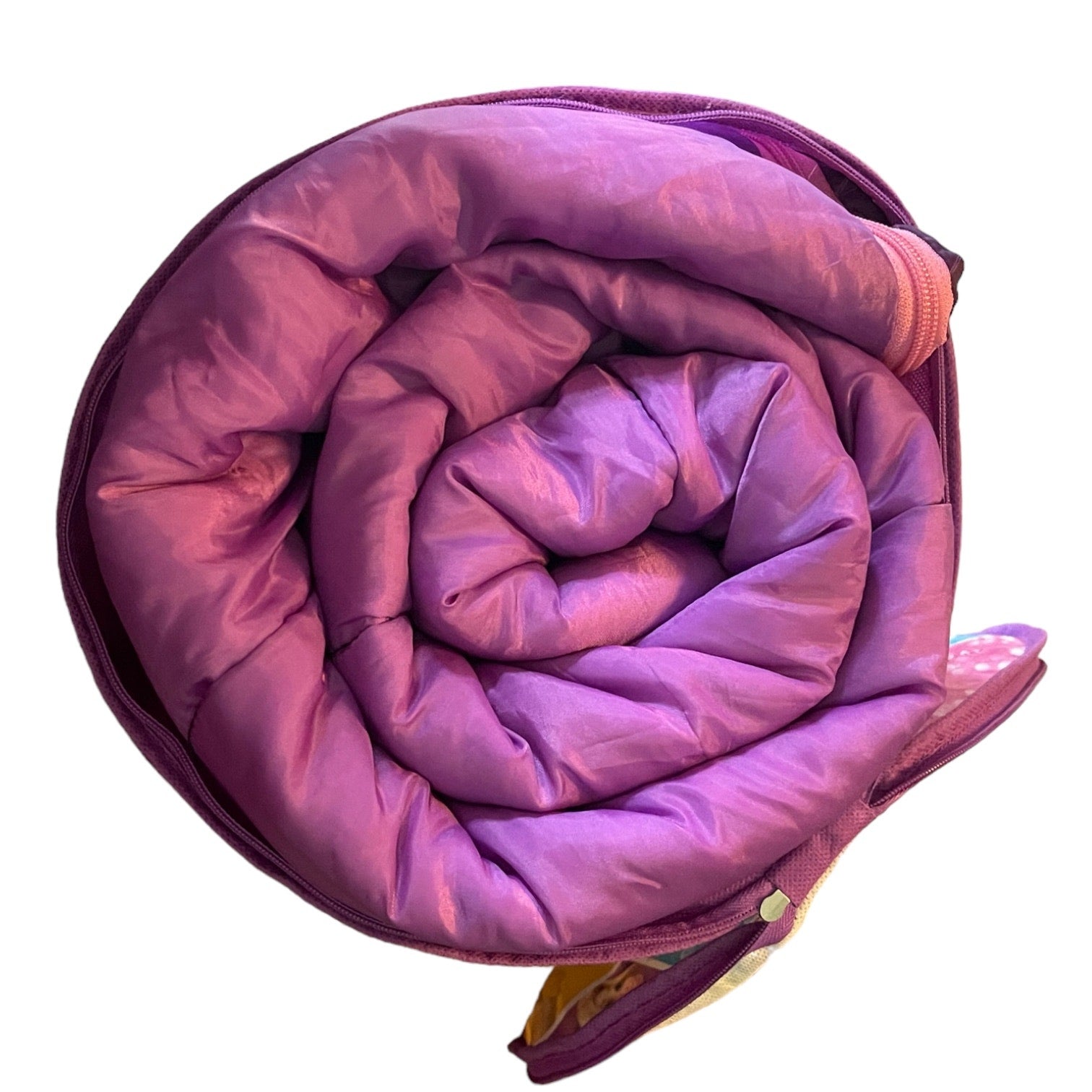 Purple sleeping bag rolled up in a bag on a white background