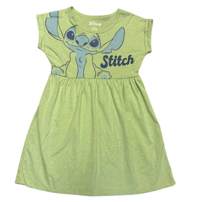 Green dress with 'Stitch' character on a white background