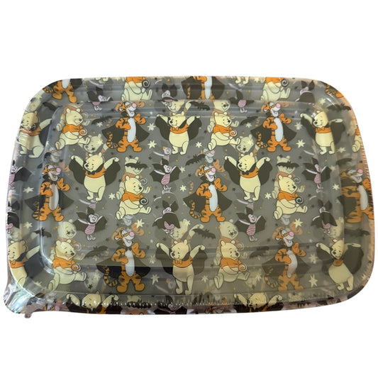A rectangular plastic container with rounded corners, featuring a repeating Halloween-themed pattern of Winnie the Pooh characters like Pooh, Tigger, and Piglet on a gray background.