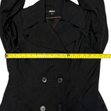Black coat with a measuring tape across it, featuring the DKNY brand.