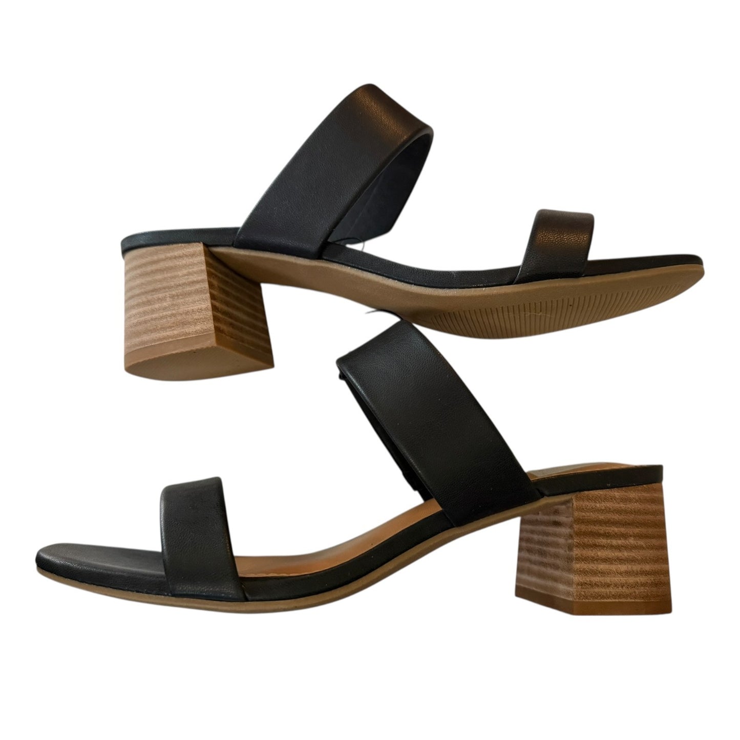 Black sandals with wooden block heels on a white background