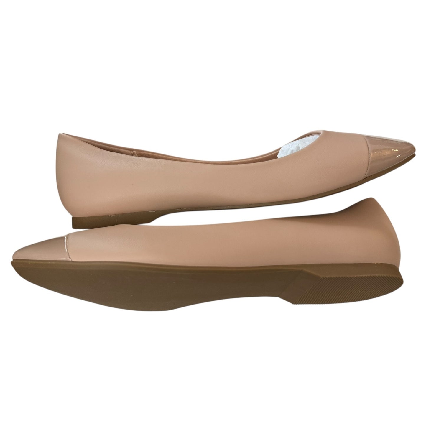 Pair of blush flat shoes on a white background