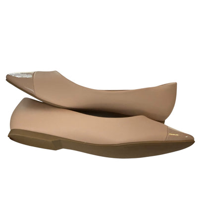 Pair of blush flats on a white background