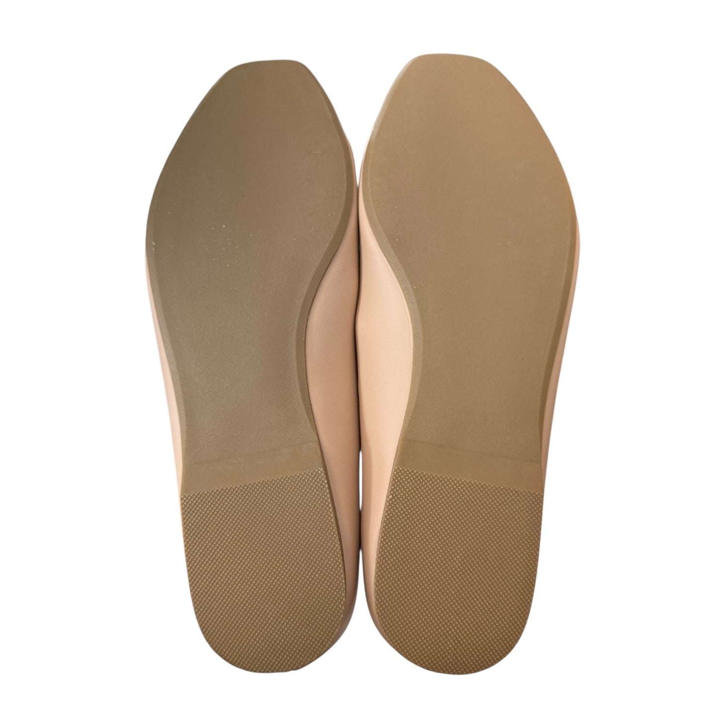 Pair of blush shoe insoles on a white background