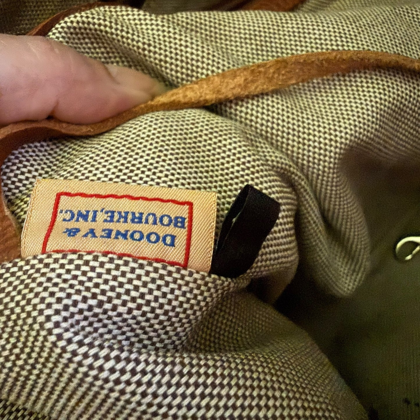 Close-up of a label on a textured fabric surface