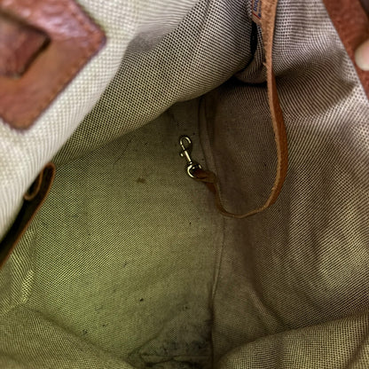 interior of purse with stain with a metal clasp.
