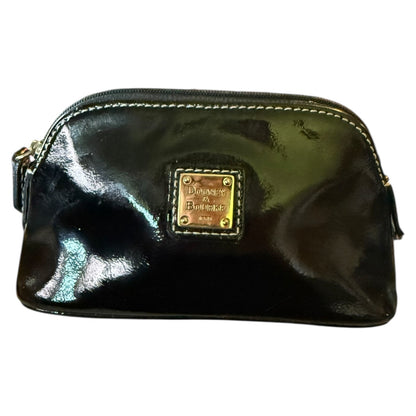 Front of Black patent leather pouch with gold hardware on a white background