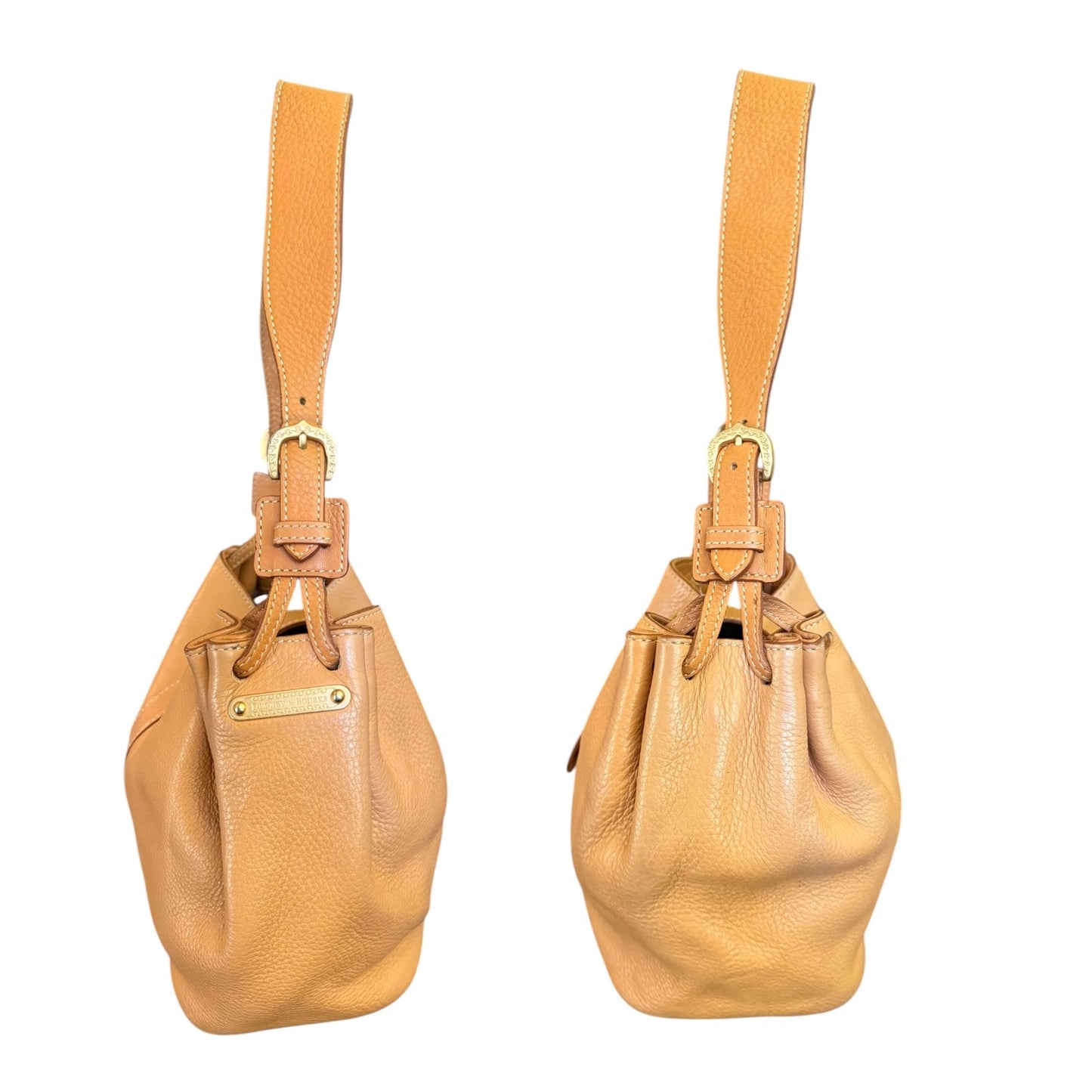 Tan leather handbag side view with matching strap on a white background
