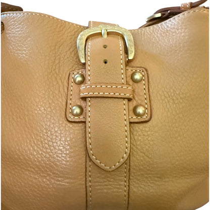 Leather handbag with gold buckle and hardware on a white background