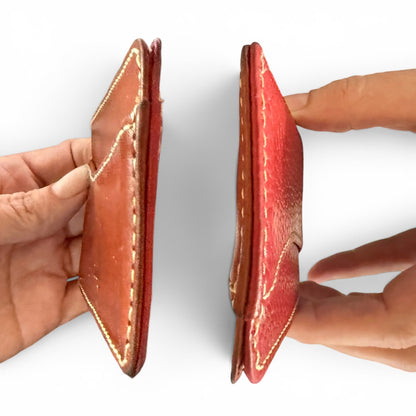 Side view of leather wallet against a white background