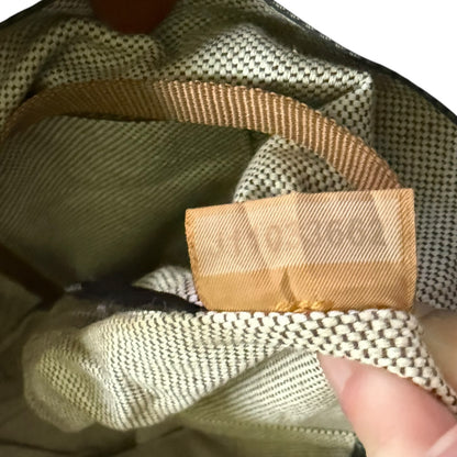 Close-up of a textured fabric with a visible brand label.