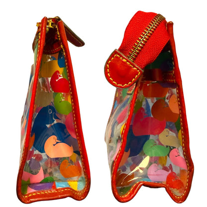 Side view of Transparent bag with colorful animal prints and red zipper on a white background