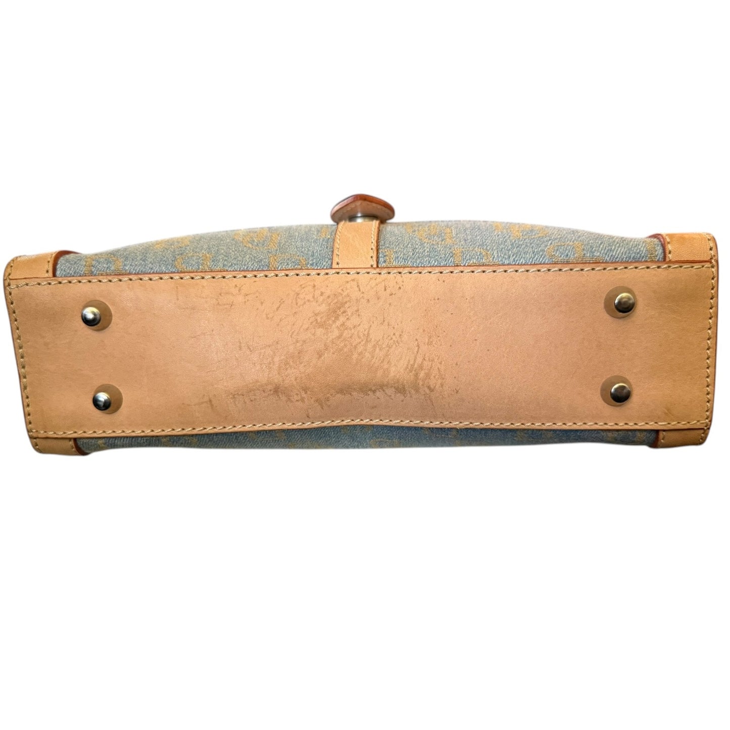 Handbag with beige leather with issues and blue fabric on a white background