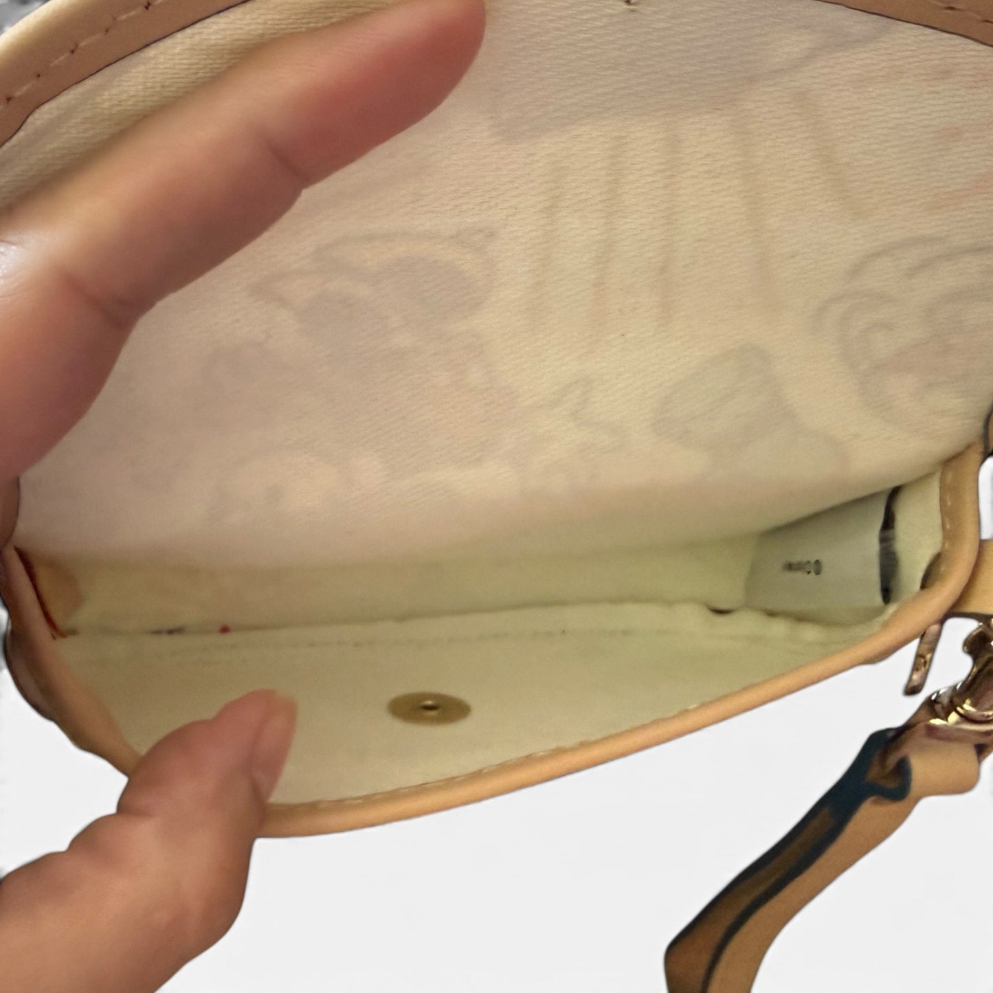 Interior of bag with a visible brand label on a white background