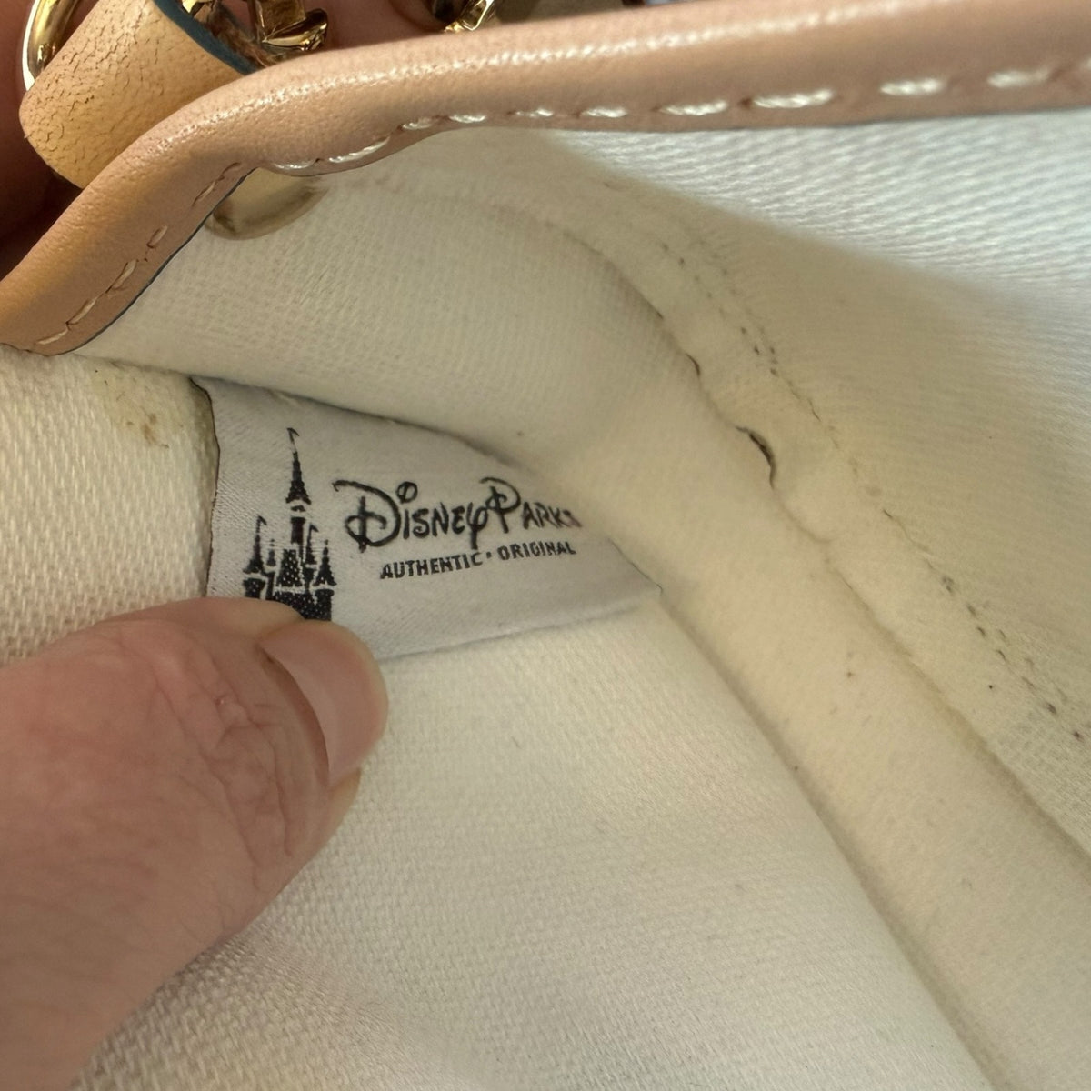 Close-up of a Disney Parks label on a interior of bag.